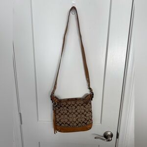 Coach signature crossbody bag.